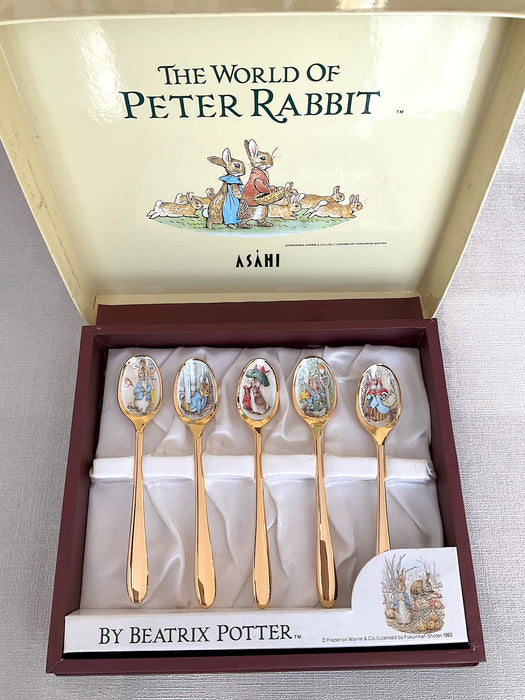 Set of 5 stainless steel gold spoons with Peter Rabbit illustrations on the mouthpart