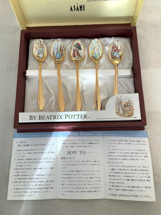 Set of 5 stainless steel gold spoons with Peter Rabbit illustrations on the mouthpart