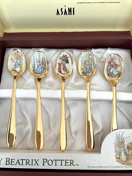 Set of 5 stainless steel gold spoons with Peter Rabbit illustrations on the mouthpart