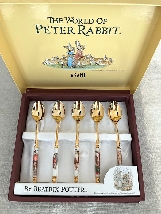 Set of 5 stainless steel gold spoons with Peter Rabbit illustrations on the handles