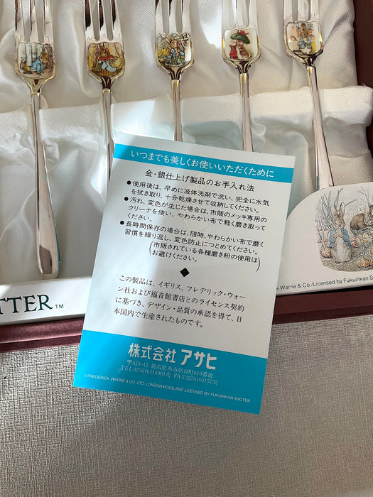 Set of 10 stainless steel spoons + forks with Peter Rabbit illustrations on the mouthpart