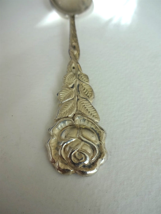 Spoon with rose on handle