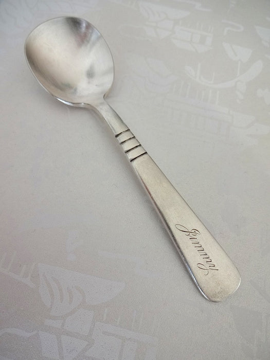 Baby spoon with "Jimmy" on the handle