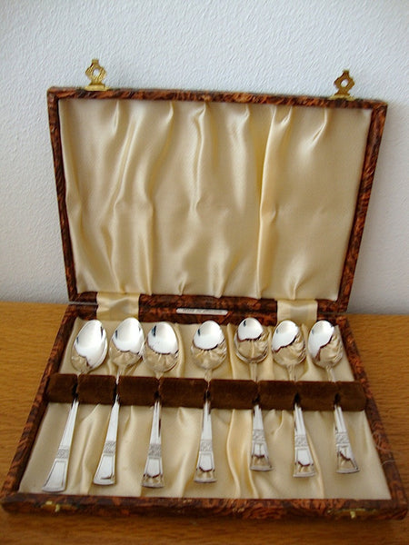 7 small teaspoons from England, in original box