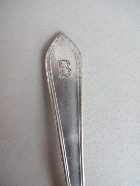 .Baby spoon with " B" on handle