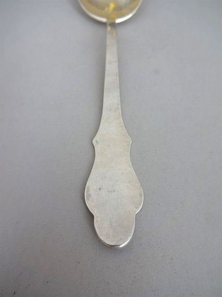 .Sterling silver spoon with gold plated top