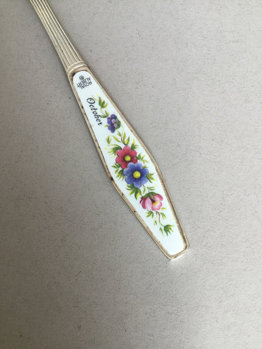 Small spoon with flowers on handle and "October"
