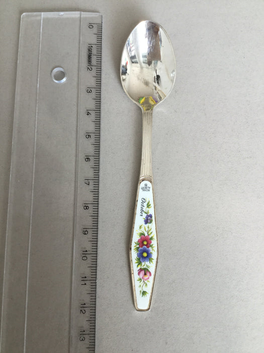 Small spoon with flowers on handle and "October"